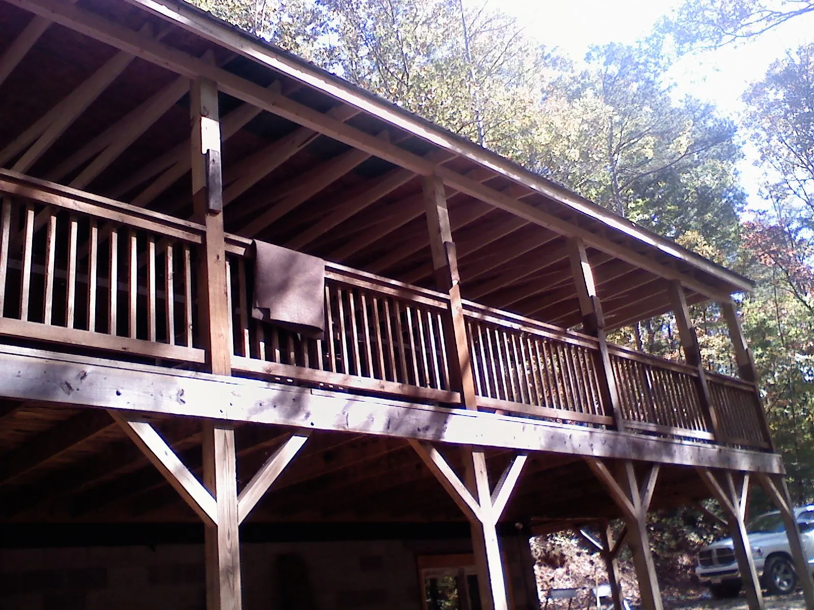 Timber framing under a new elevated porch and deck — Roof Leak Repair in North Kingstown by Roofing Brothers